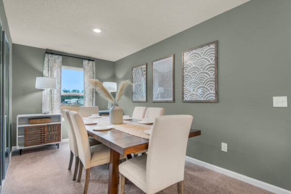 The dining room of the Addison floorplan by Holiday Builders is from our Value collection in the Gulf region.