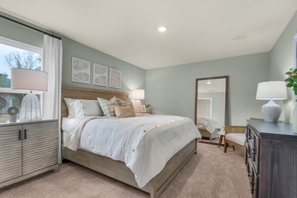 The master bedroom of the Addison floorplan by Holiday Builders is from our Value collection in the Gulf region.