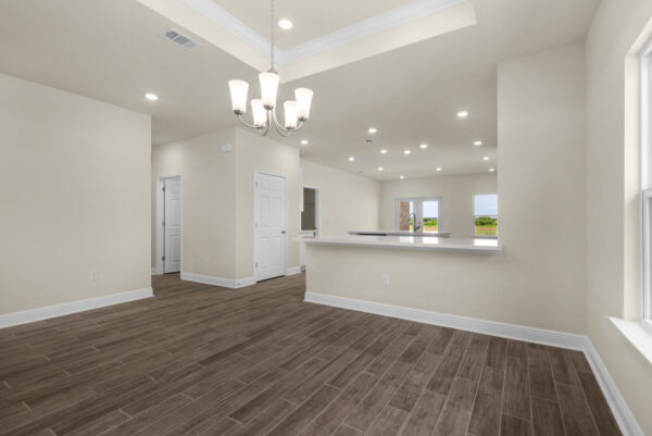 The dining area of the Bay floorplan from the Cornerstone Collection by Holiday Builders.
