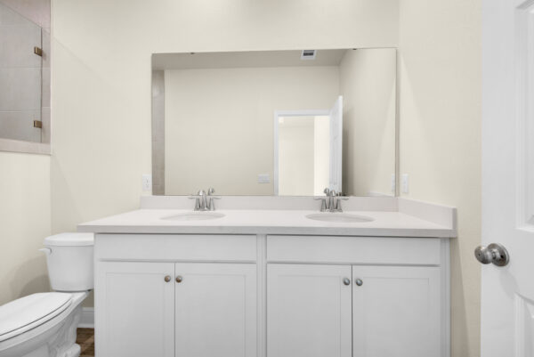 The owners bath vanity of the Bay floorplan from the Cornerstone Collection by Holiday Builders.