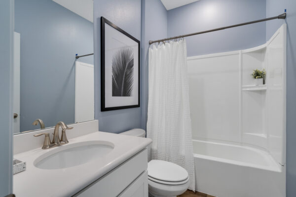 The guest bath in the Biscayne floorplan from the Cornerstone collection by Holiday Builders.