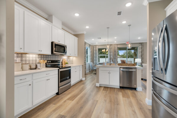 The kitchen in the Biscayne floorplan from the Cornerstone collection by Holiday Builders.