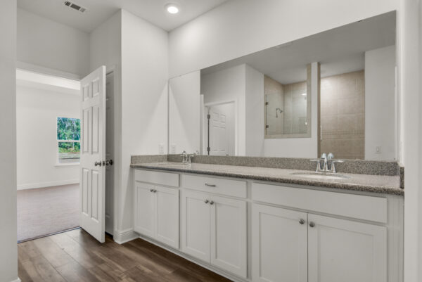 The master bath in the Caliza floorplan from the Cornerstone collection by Holiday Builders.