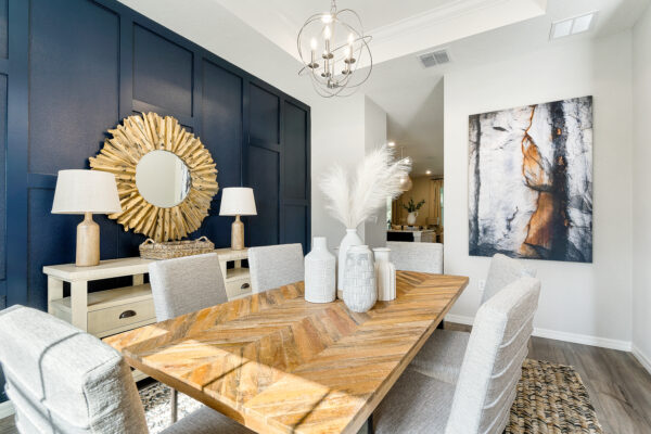 The dining room in the Captiva floorplan from the Cornerstone collection by Holiday Builders.