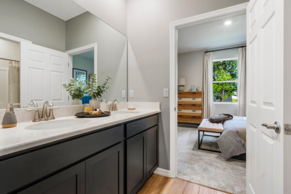 The jack and jill bathroom in the Captiva floorplan from the Cornerstone collection by Holiday Builders.