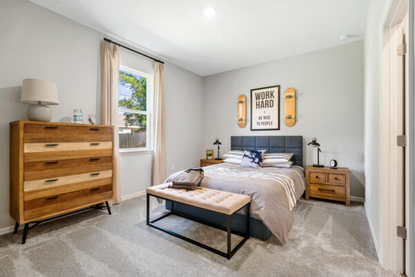 A boy's skate themed bedroom in the Captiva floorplan from the Cornerstone collection by Holiday Builders.