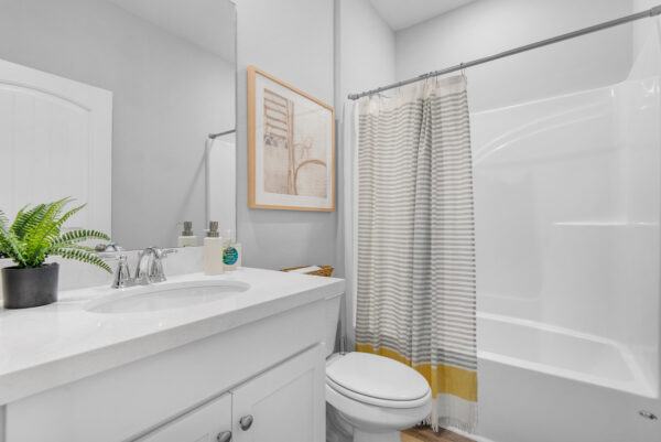 The guest bath in the Carlton floorplan from the Cornerstone collection by Holiday Builders.