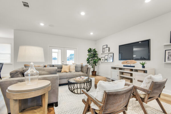 The living area in the Carlton floorplan from the Cornerstone collection by Holiday Builders.