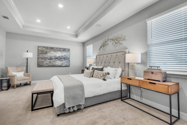 The master bedroom in the Carlton floorplan from the Cornerstone collection by Holiday Builders.