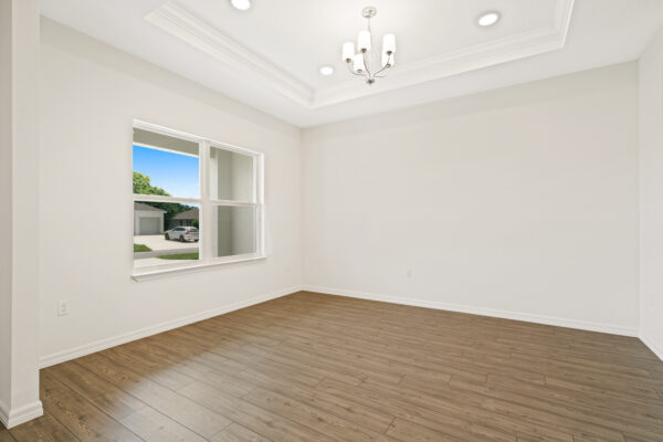 The living room in the Cedar floorplan from the Cornerstone collection by Holiday Builders.