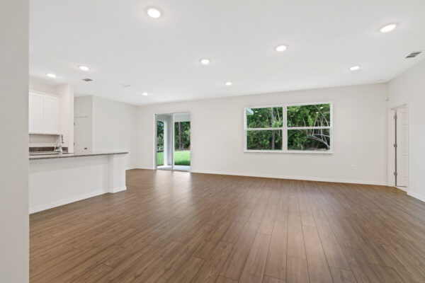 The living area in the Cedar floorplan from the Cornerstone collection by Holiday Builders.