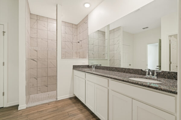 The master bath in the Cedar floorplan from the Cornerstone collection by Holiday Builders.