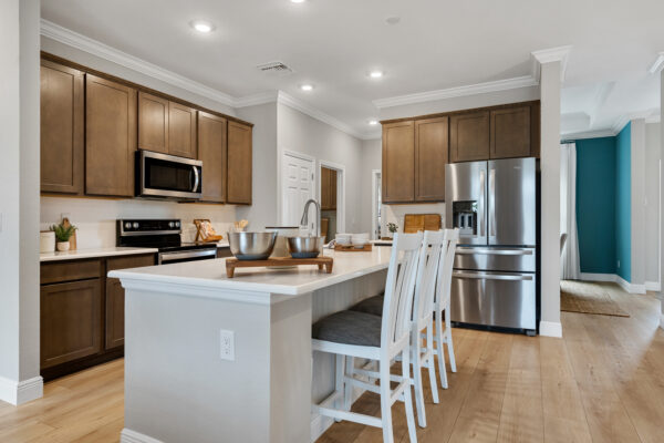 The kitchen in the Charlotte floorplan from the Cornerstone collection by Holiday Builders.