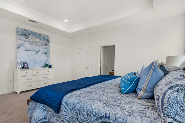 The master bedroom in the Cypress floorplan from the Cornerstone collection by Holiday Builders.