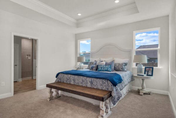 The master bedroom in the Cypress floorplan from the Cornerstone collection by Holiday Builders.