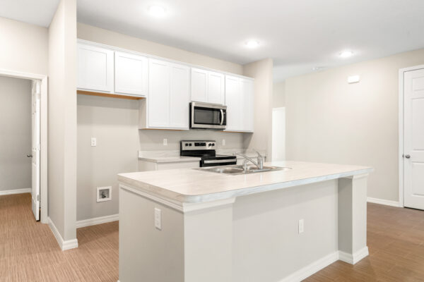 The kitchen in the Delray floorplan from the Cornerstone collection by Holiday Builders.