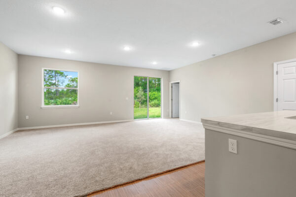 The living area in the Delray floorplan from the Cornerstone collection by Holiday Builders.