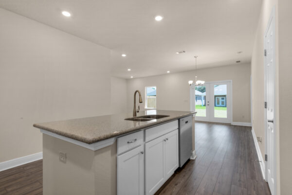 The kitchen view in the Denham floorplan of the Cornerstone collection by Holiday Builders.
