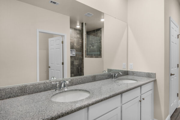 The master bath in the Denham floorplan of the Cornerstone collection by Holiday Builders.