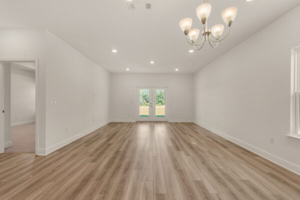 The living area in the Destin floorplan from the Cornerstone collection by Holiday Builders.