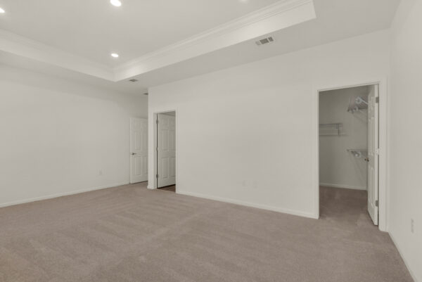 The master bedroom in the Dora floorplan from the Cornerstone collection by Holiday Builders.