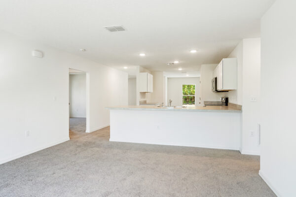 The living area in the Foxtail floorplan from the Value collection by Holiday Builders.