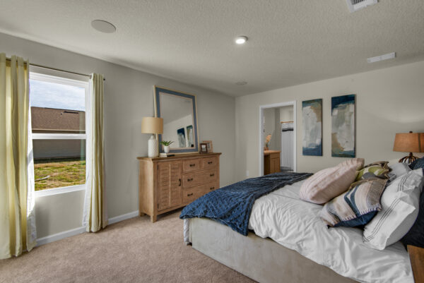 The master bedroom in the Grayton floorplan from the Value collection by Holiday Builders.