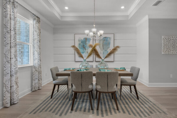 The living room in the Hamilton floorplan from the Cornerstone collection by Holiday Builders.