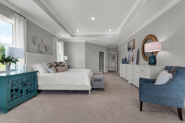 The spacious master bedroom in the Hamilton floorplan from the Cornerstone collection by Holiday Builders.