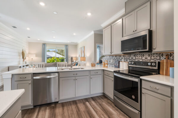 The kitchen in the Highland floorplan from the Cornerstone collection by Holiday Builders.
