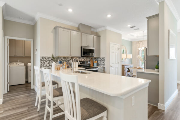 The kitchen island in the Highland floorplan from the Cornerstone collection by Holiday Builders.