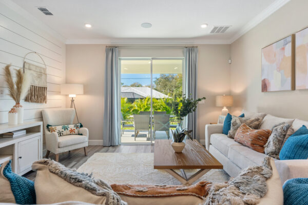 The living area in the Highland floorplan from the Cornerstone collection by Holiday Builders.