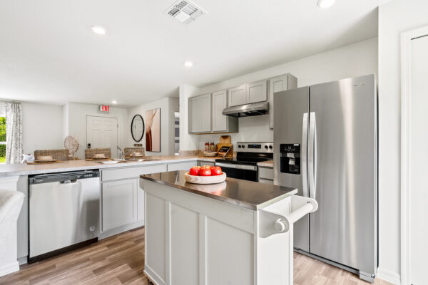 The kitchen of the Palm floorplan from the Inspire Collection