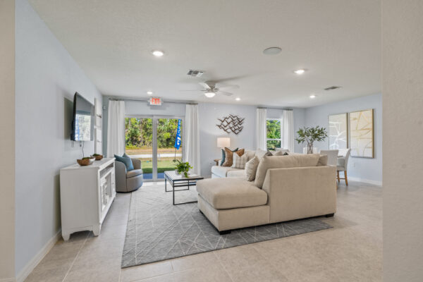 The living and dining area of the Majestic floorplan from the Holiday Builders Value Collection