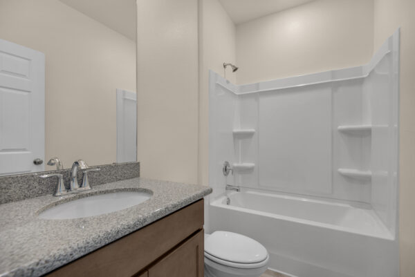 The guest bath in the Miramar floorplan from the Cornerstone Collection by Holiday Builders.