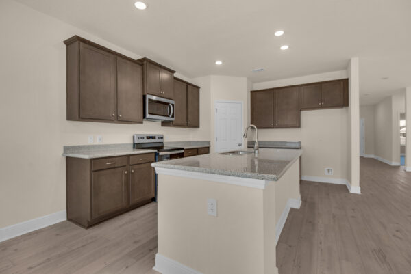 The kitchen in the Miramar floorplan from the Cornerstone Collection by Holiday Builders.
