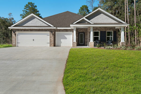 The exterior of the Navarre floorplan from the Cornerstone collection by Holiday Builders.