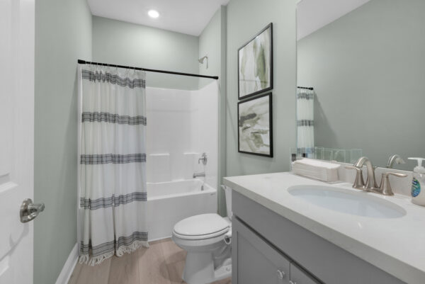 The guest bath in the Navarre floorplan from the Cornerstone collection by Holiday Builders.