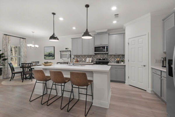The kitchen in the Navarre floorplan from the Cornerstone collection by Holiday Builders.