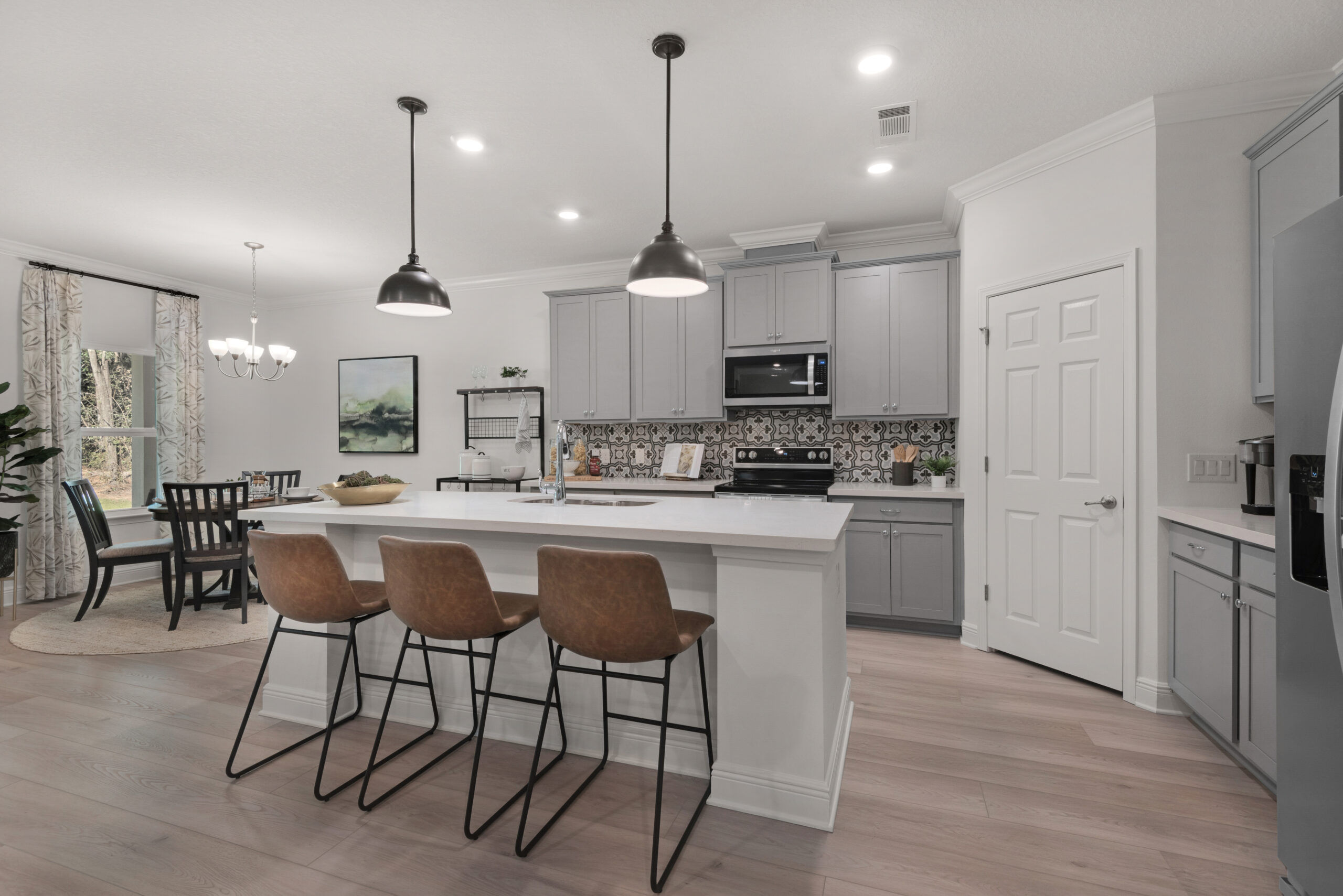 The kitchen in the Navarre floorplan from the Cornerstone collection by Holiday Builders.