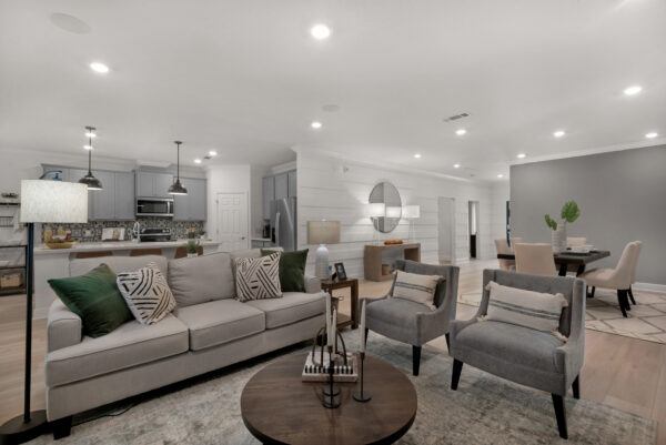 The living area in the Navarre floorplan from the Cornerstone collection by Holiday Builders.