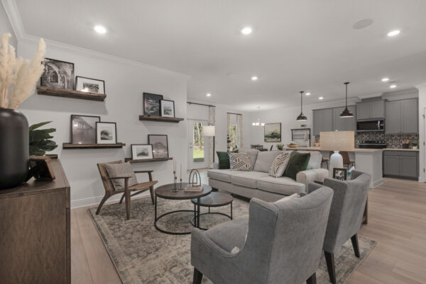 The living and kitchen areas in the Navarre floorplan from the Cornerstone collection by Holiday Builders.