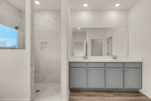 The master bath in the Osprey floorplan from the Cornerstone collection by Holiday Builders.