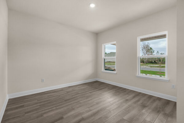 The den in the Osprey Floorplan from the Cornerstone Collection by Holiday Builders.