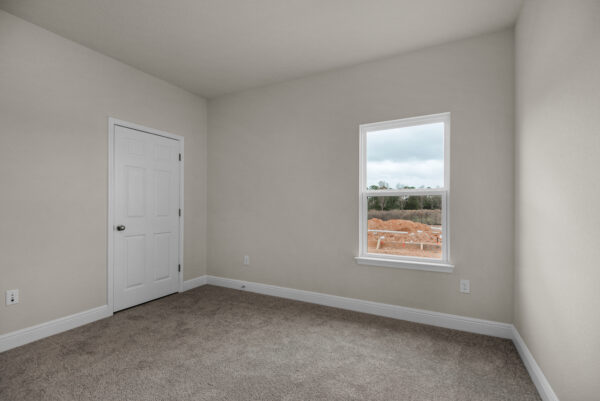The guest bed 2 in the Osprey Floorplan from the Cornerstone Collection by Holiday Builders.