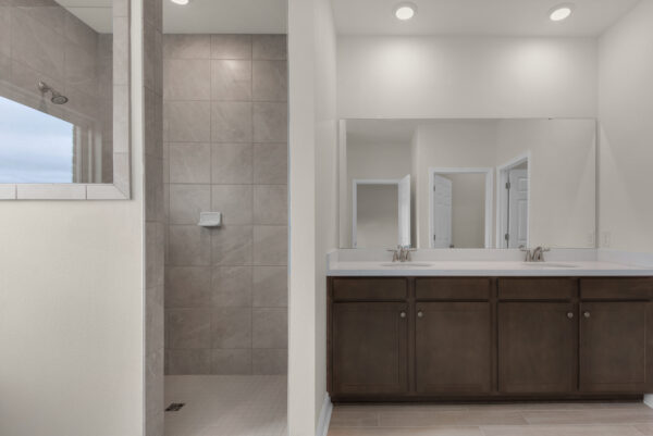 The owner's bath in the Osprey Floorplan from the Cornerstone Collection by Holiday Builders.