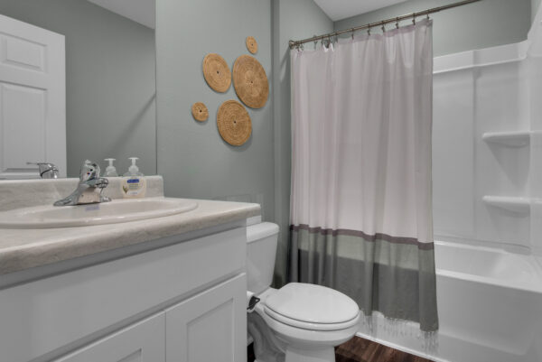 The guest bath in the Palmer floorplan from the Value collection by Holiday Builders.