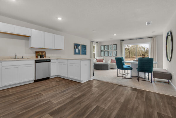 The kitchen and dining areas in the Palmer floorplan from the Value collection by Holiday Builders.