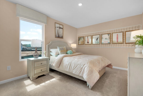 A girl's volleyball themed bedroom in the Palmer floorplan from the Value collection by Holiday Builders.