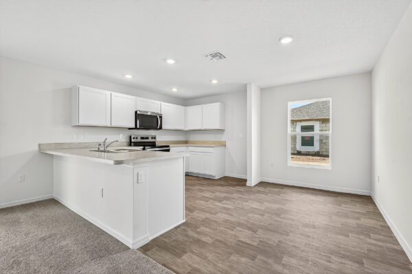 The kitchen and dining areas in the Palmetto floorplan from the Value Collection by Holiday Builders